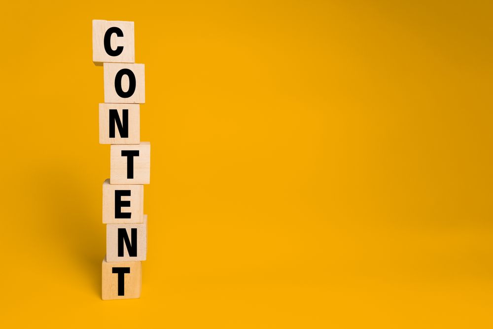 male hand put wooden blocks with content word isolated on yellow background