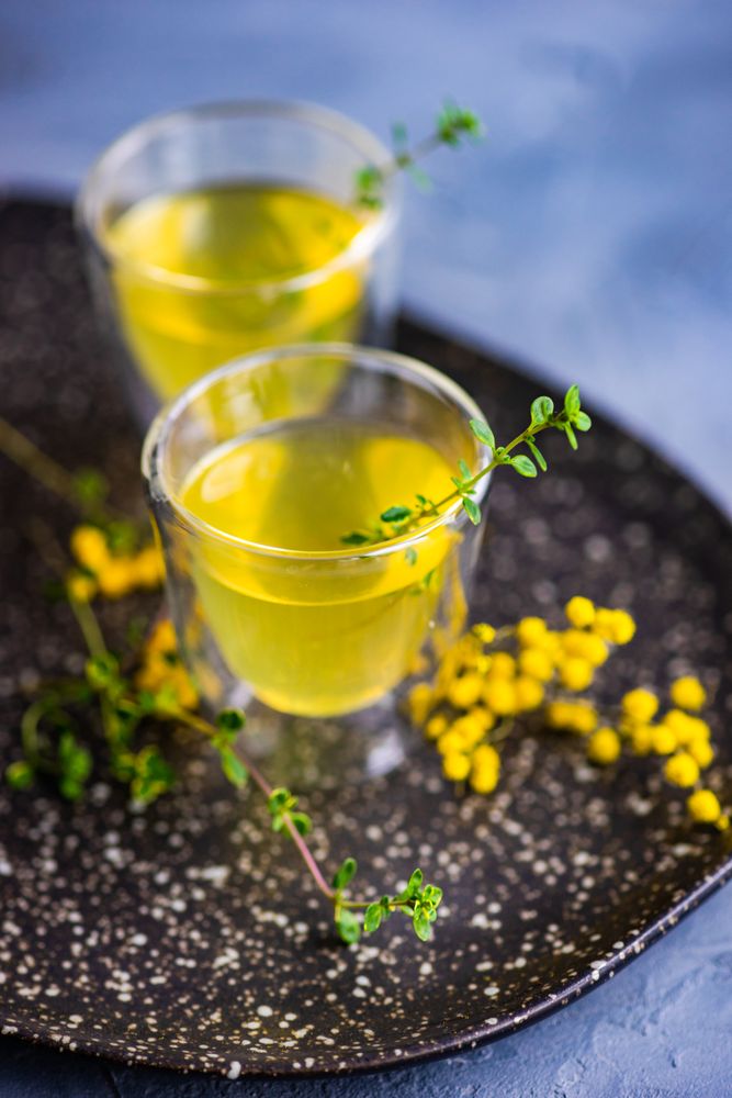 Close up of two glasses of limoncello with garnish