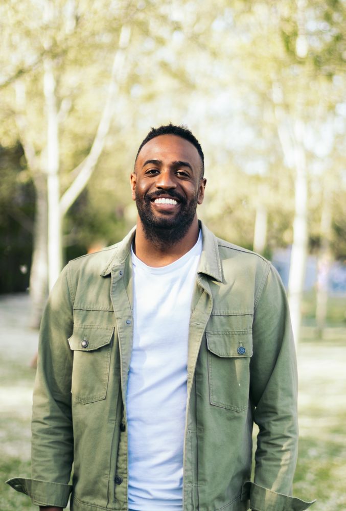 young Black man portrait in a park