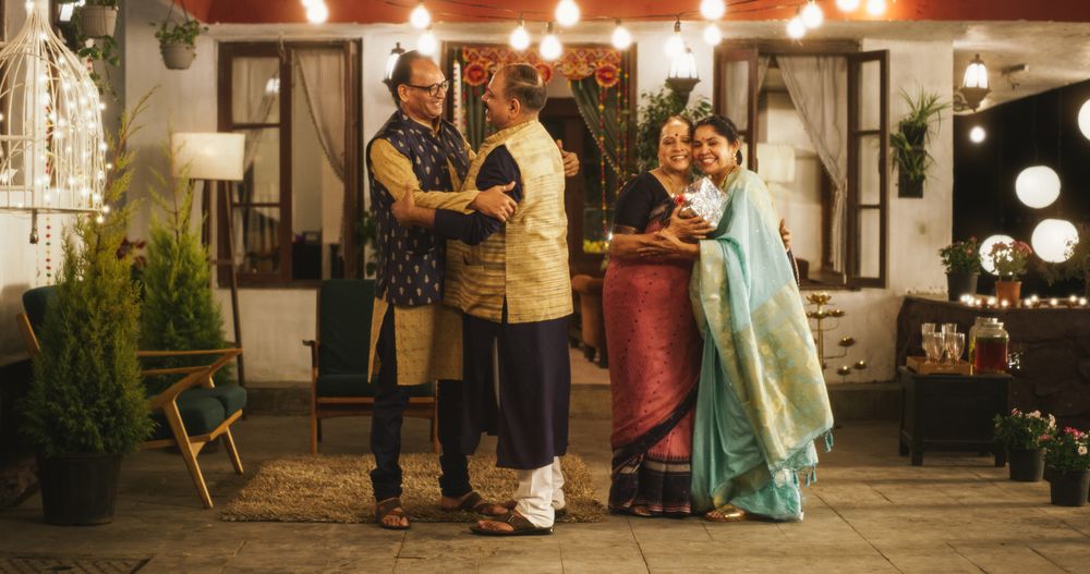 Authentic Shot of Indian Elderly Couple Receiving Family Relatives Over.