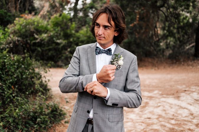 Groom walking on road at nature