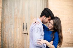 Amorous couple standing near columns