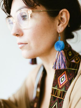 Portrait of woman with handmade earring