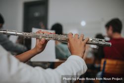 Close up of student playing the flute during band practice 5rM320