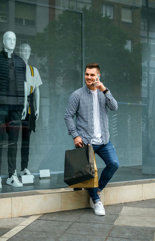 Young man with shopping bags