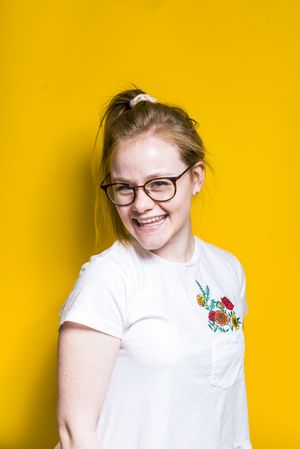 Blonde woman posing in wall