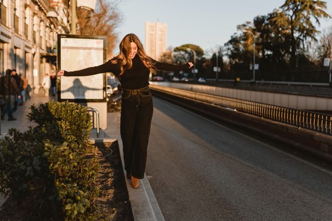 Stylish woman standing near metro station