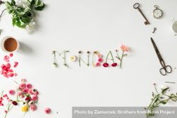 Word "MONDAY" made of flowers with various things on desk bEyX1b