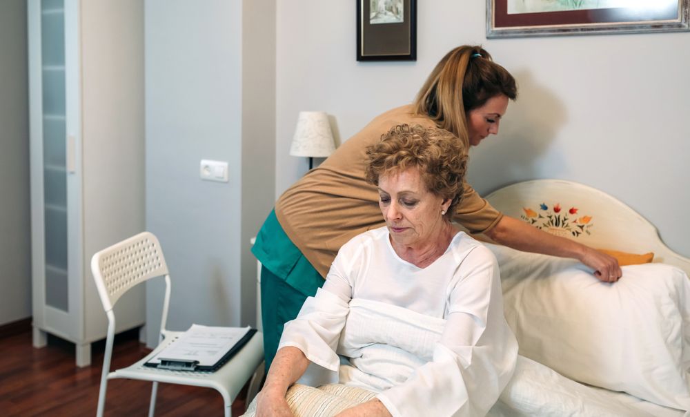 Caregiver accommodating pillow to mature patient