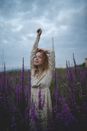 Romantic women in salvia field
