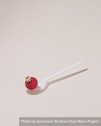 Red Christmas bauble on a spoon 4d9Lab