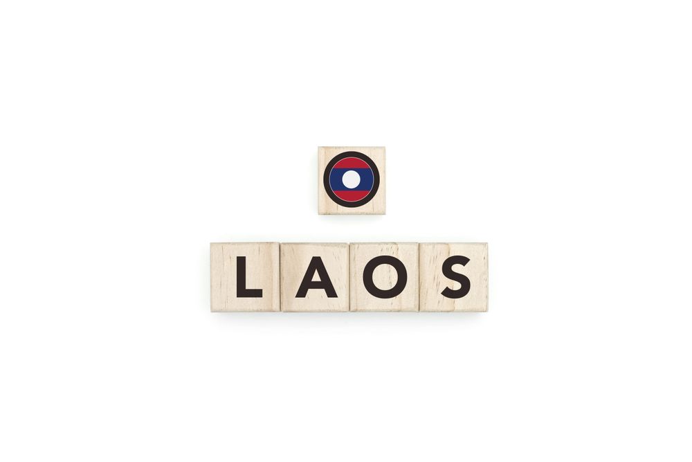 Wooden blocks bearing the name and flag of Laos.