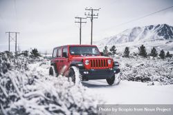 Red SUV in snowy field 4mG2e0