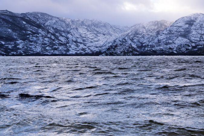 Shore with mountains near water