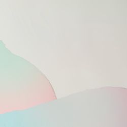 Pieces of ripped pastel colored paper in pattern