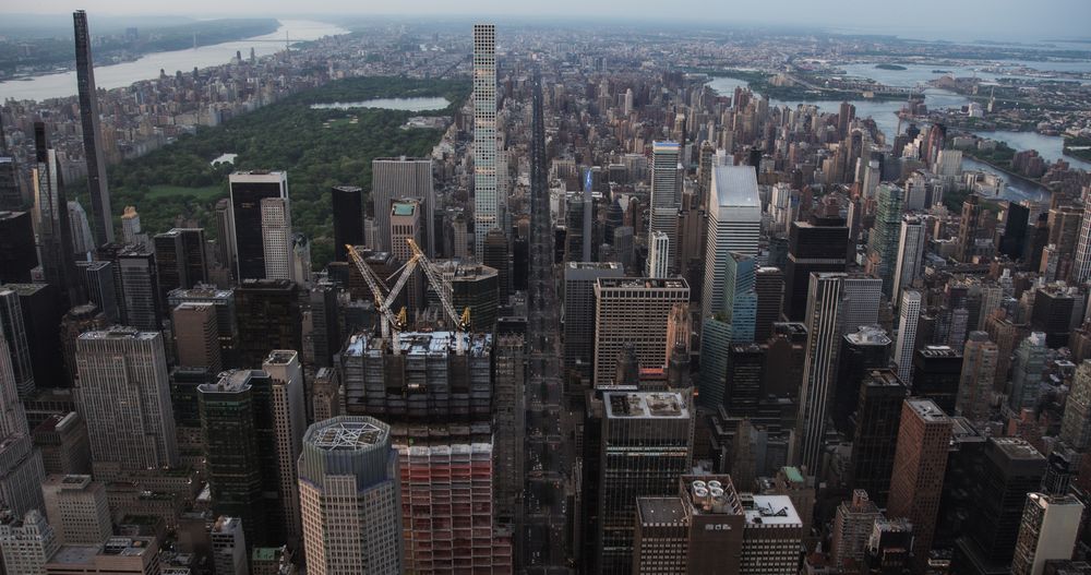 Urban Sunset Scenery with Midtown Manhattan. Historic and Modern New York City Skyscrapers, New Building Under Construction. Aerial View of a Popular American Travel and Business Destination