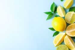 Flat lay composition with citrus on color background, space for text