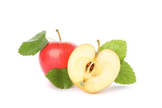 Sweet apples with leaves isolated on light background