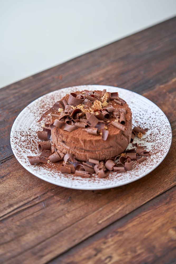 Delicious chocolate cake on wooden table