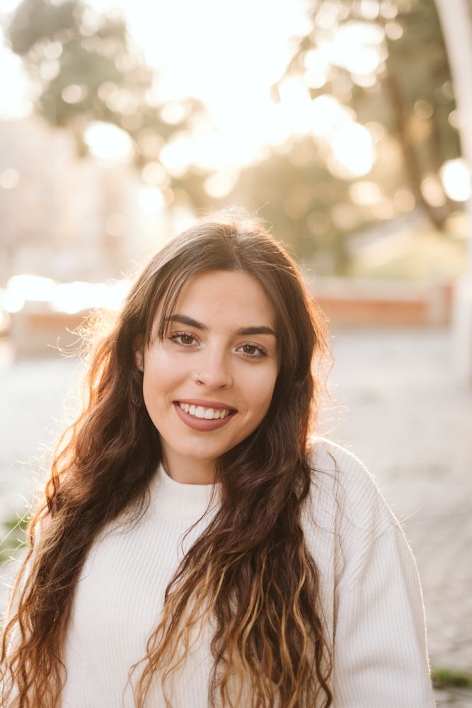 Cheerful young woman in street
