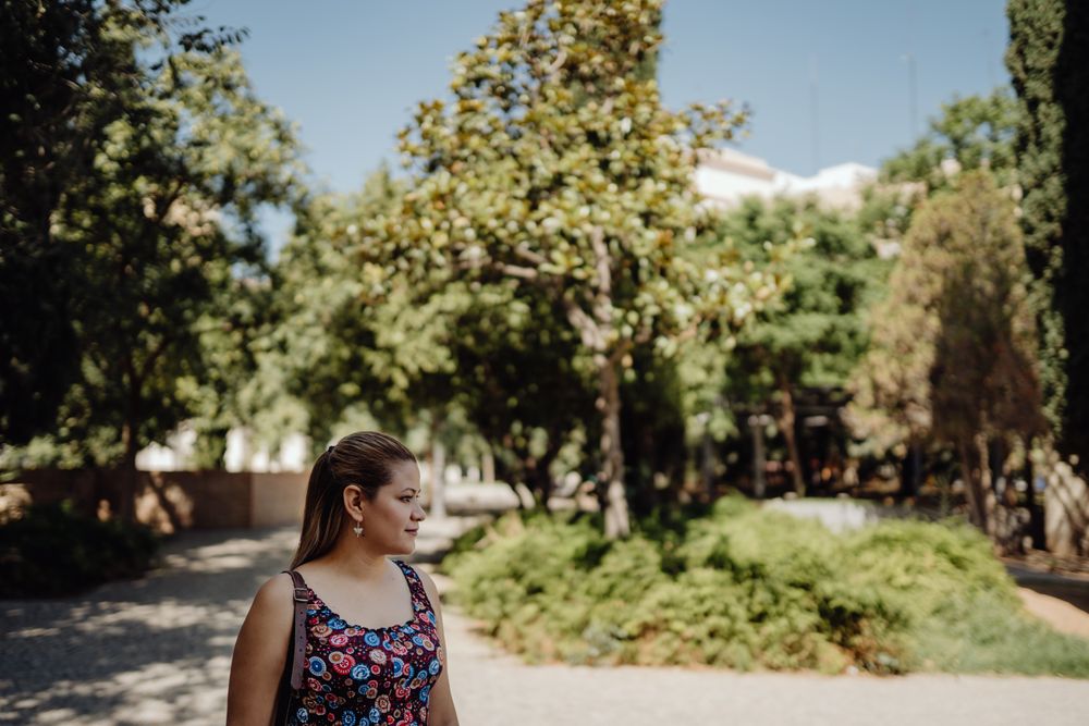 woman looking away walking at park
