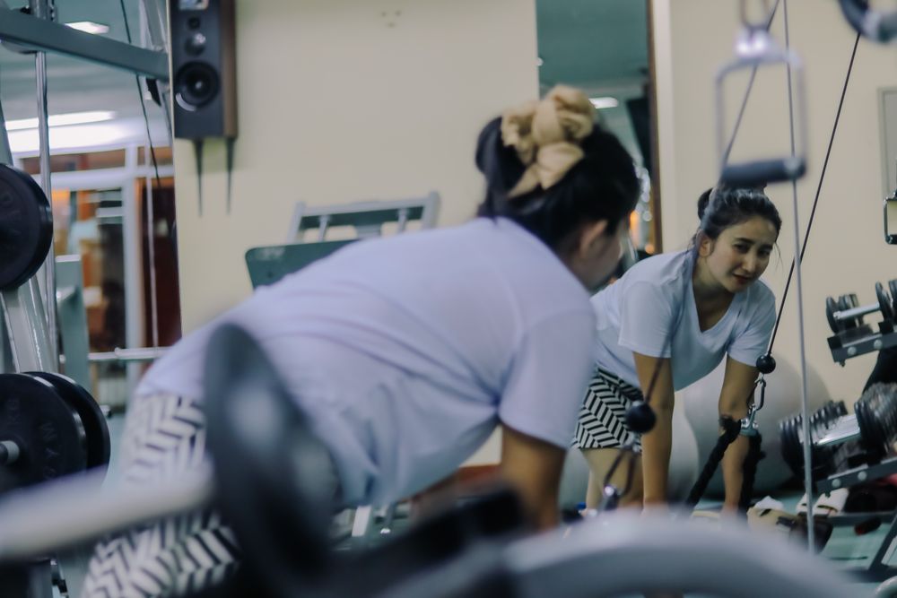 woman in Indonesia exercising in a fitness center