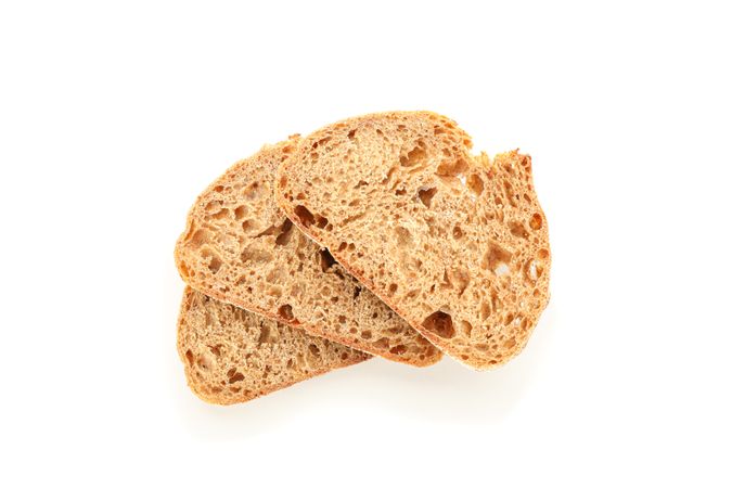 Wheat bread pieces isolated on blank background. Bakery products