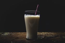 Glass of milk on table