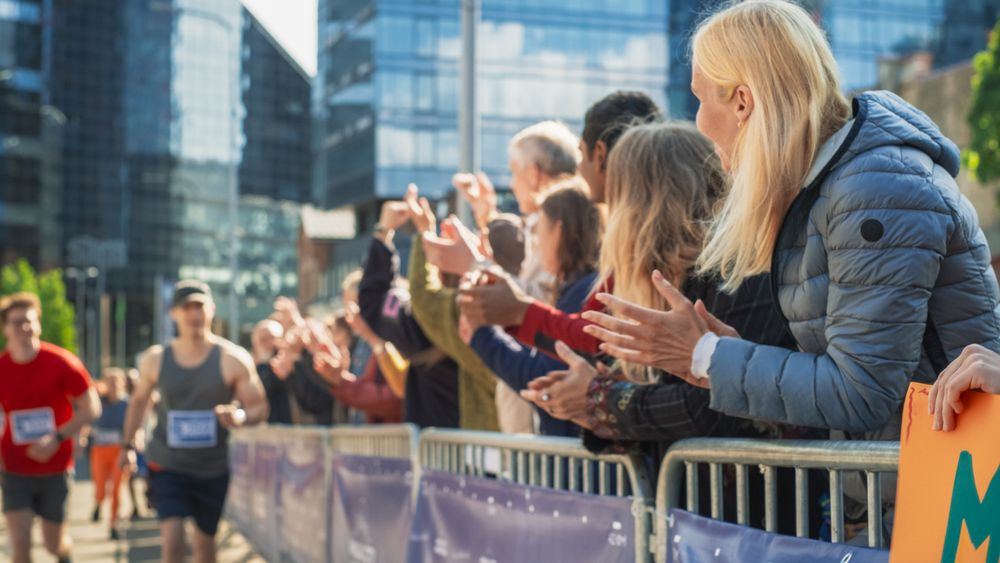 Marathon Audience Supporting and Cheering Their Loved Ones Participating in the Race
