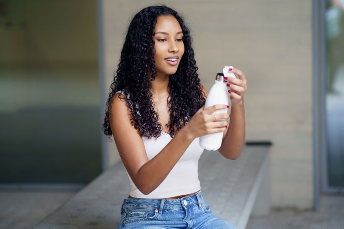 A Young Woman is Enjoying a Refreshing and Delicious Drink in a Modern and Stylish Setting