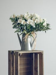 Bouquet of flowers in watering can