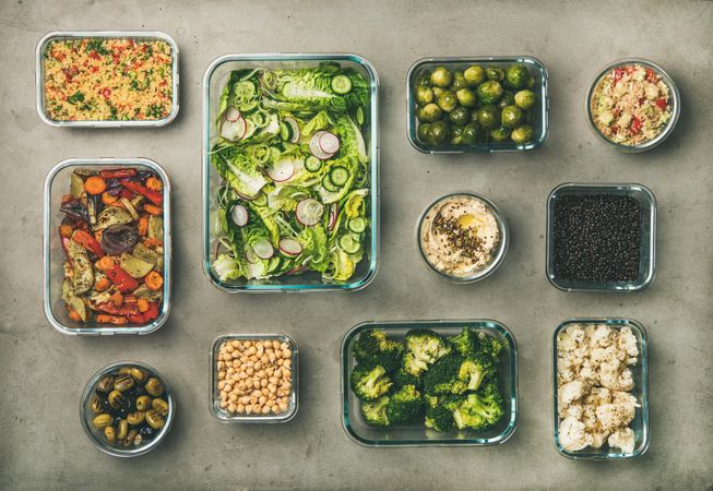 Variety of vegetable dishes arranged in glass containers