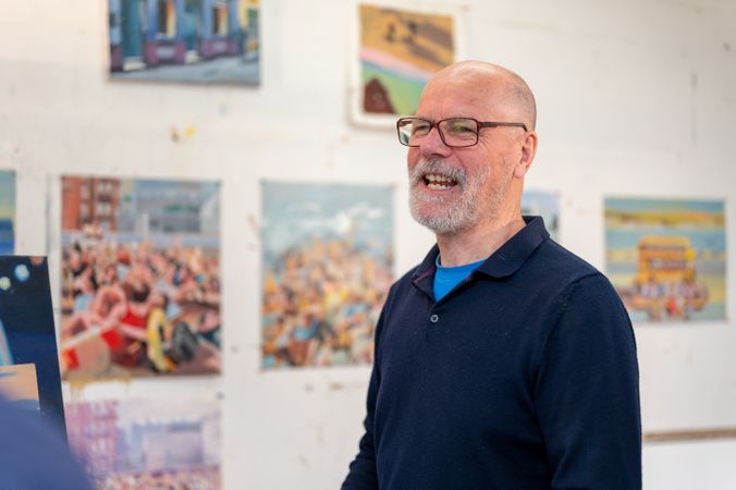 Smiling older male in art studio