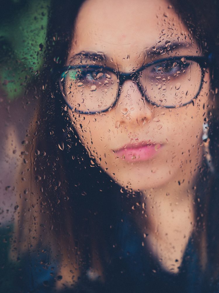 Woman in eyeglasses and earrings