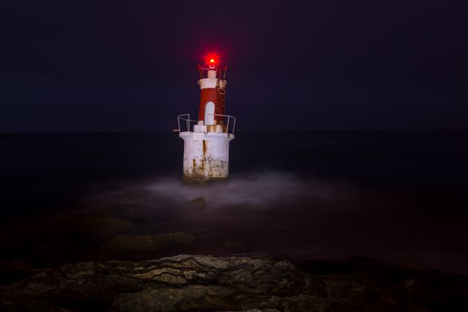 Lighthouse on rocky coastline