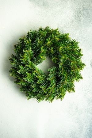 Plane Christmas wreath on marble counter