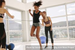 Females enjoying jumping rope workout at gym 4NEN6m