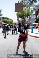 Los Angeles, CA, USA — June 14th, 2020: man standing in street holding protest sign over his head 4d8kl4
