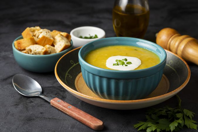 Bowl with pumpkin soup on the table.