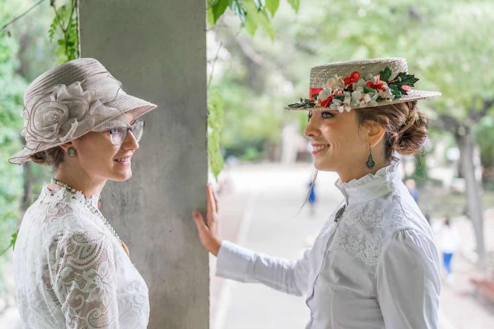 Vintage female friends speaking in garden