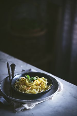 Delicious noodles served with green and vegetable