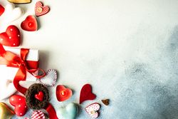 Top view of various Valentine's day items, heart candles, ornaments and present
