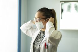 Young doctor with medical mask