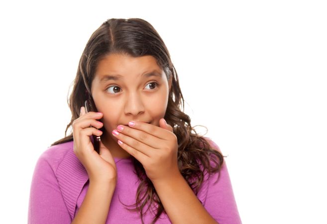 Shocked Hispanic Girl On Cell Phone