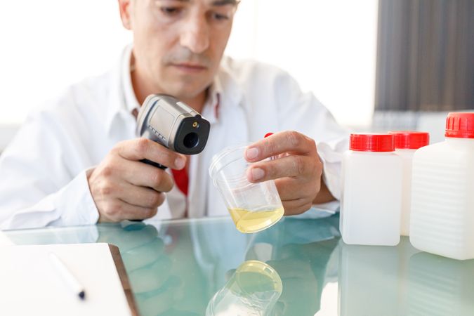 Male assistant using medical device for urine test