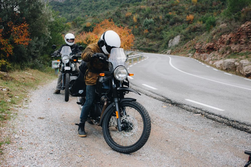 Motorcycle riders pulling over to the side of the road