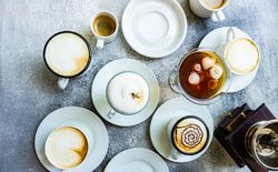 Top view of milky coffees with foam art