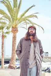 Trendy man walking in port