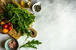 Healthy food concept with arugula, and tomatoes