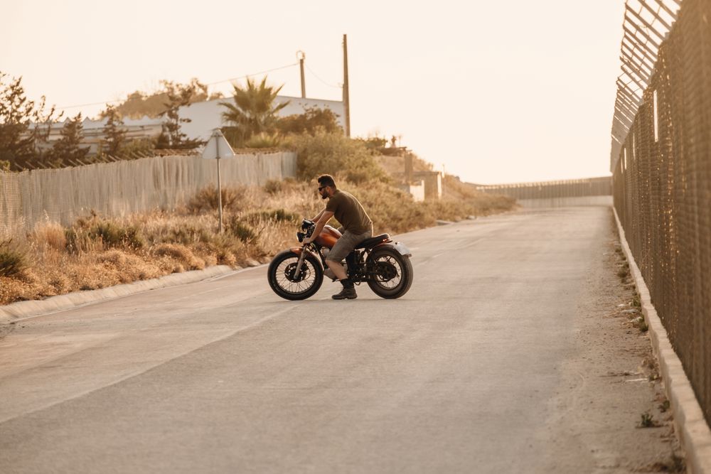Strong man driving motorcycle